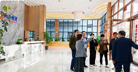 Visitors touring the company facility